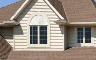 Home exterior featuring shake vinyl siding that adds texture and visual character to the design