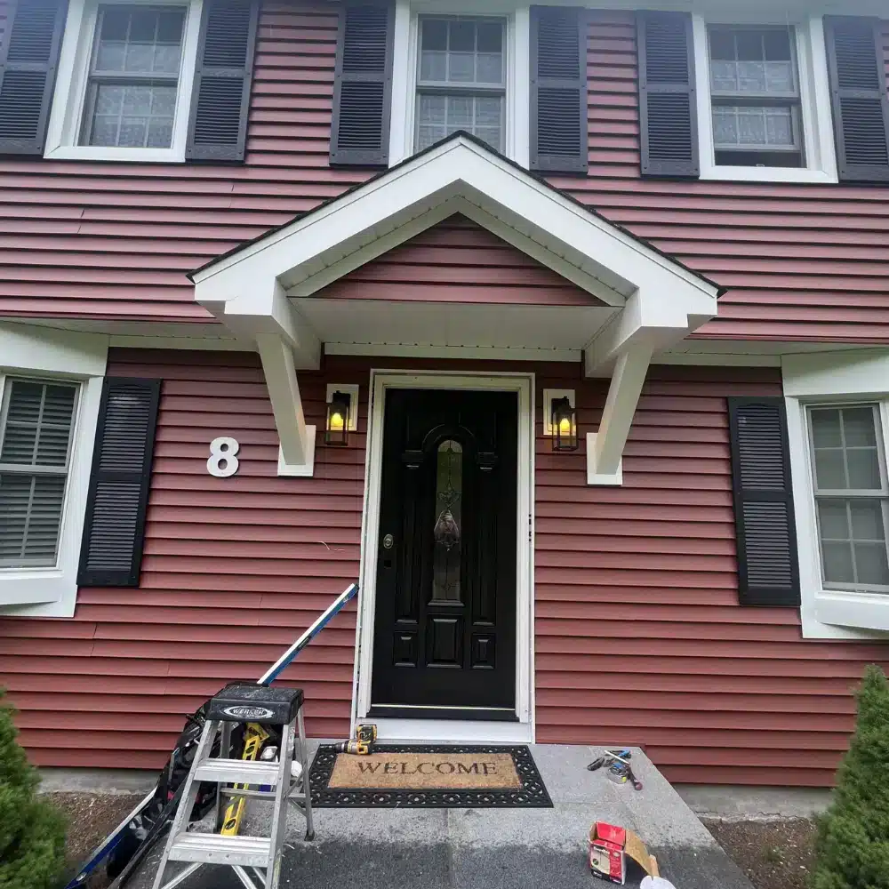 Understanding Window Installation Techniques and Considerations Professional vinyl siding contractor installing exterior siding on a home in South Windsor Connecticut