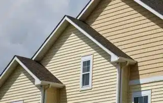 Professional vinyl siding contractor installing exterior siding on a home in Connecticut
