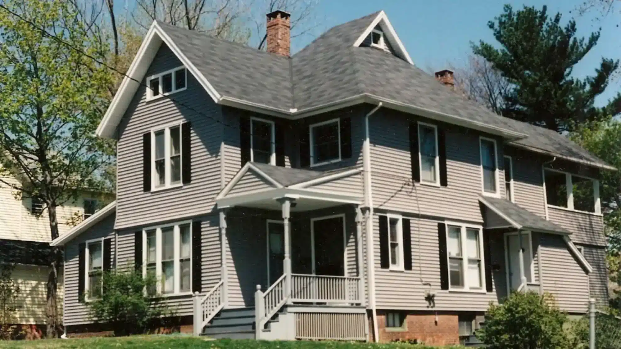 best siding company near East Granby CT Homeowner reviewing a free siding estimate with a professional contractor