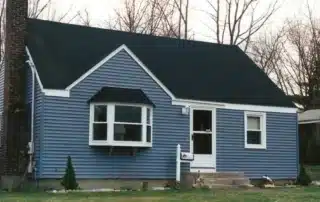Comparison of seamless and standard vinyl siding options on a house