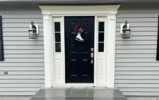 Reliable vinyl siding contractor working on a home in East Granby, Connecticut