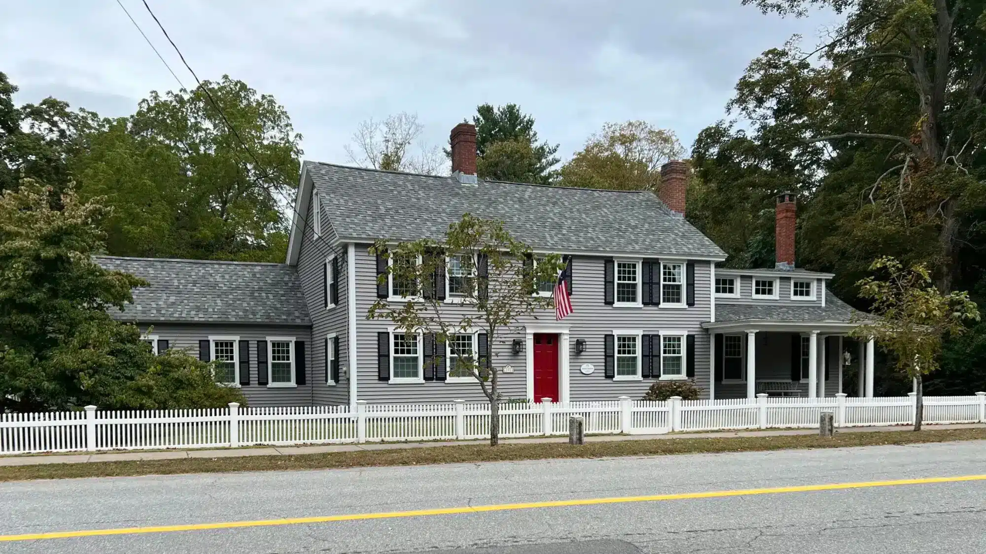 Breaking Down the Typical Cost of Gutter Guard Installation in Wethersfield, CT for Homeowners Homeowner reviewing the cost of gutter guard installation for a house in Wethersfield, Connecticut to protect gutters from debris and weather damage