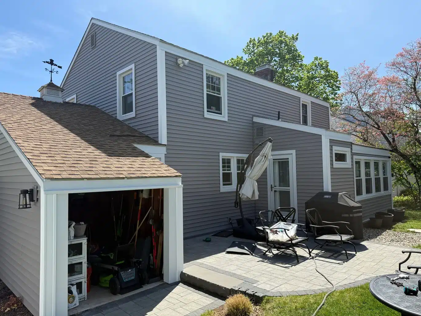 Enhanced After Vinyl Siding Vinyl Shake ProVia Entry Door Aluminum Trim Installation West Hartford CT Peter L Brown Completed exterior renovation project in West Hartford CT featuring vinyl siding, vinyl shake, ProVia entry door, and aluminum trim installation by Peter L Brown Roofing Contractors showcasing a finished residential home upgrade