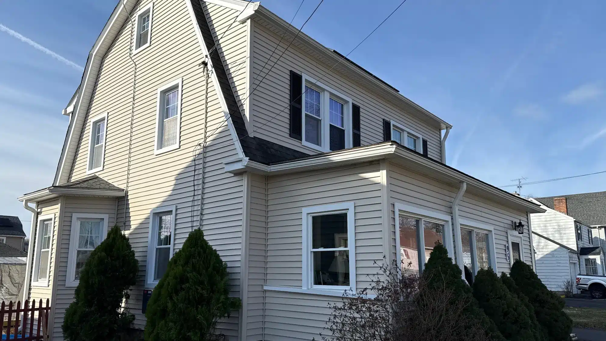how-long-it-usually-takes-to-complete-a-professional-window-installation-project Professional contractors installing replacement windows in a residential home showing window frame installation and exterior finishing work