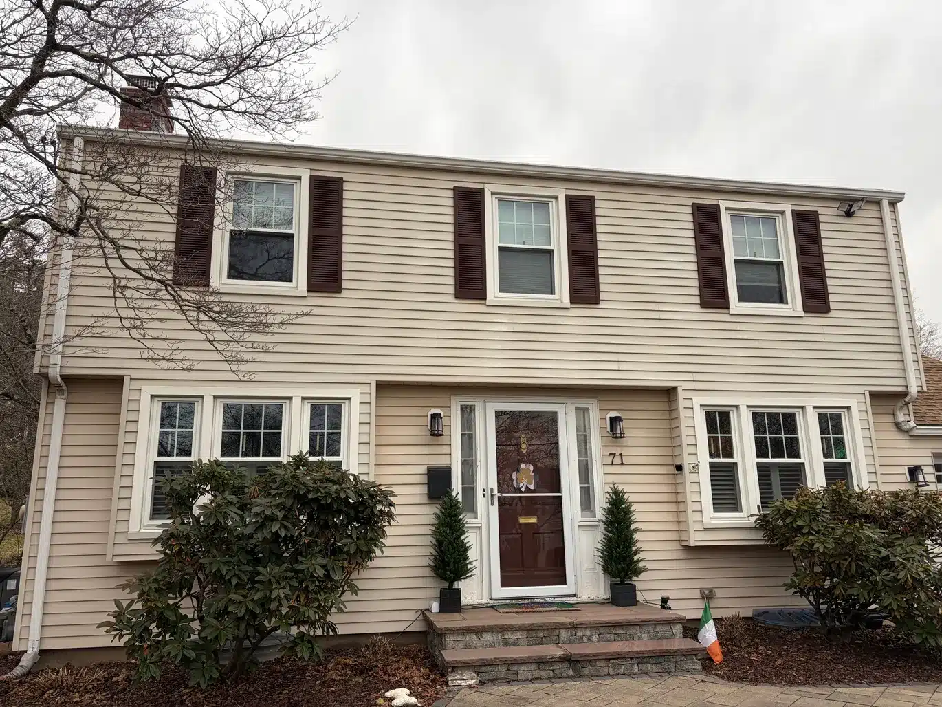 Remodeled Vinyl Siding Vinyl Shake ProVia Entry Door Aluminum Trim Installation West Hartford CT Peter L Brown Completed exterior renovation project in West Hartford CT featuring vinyl siding, vinyl shake, ProVia entry door, and aluminum trim installation by Peter L Brown Roofing Contractors showcasing a finished residential home upgrade