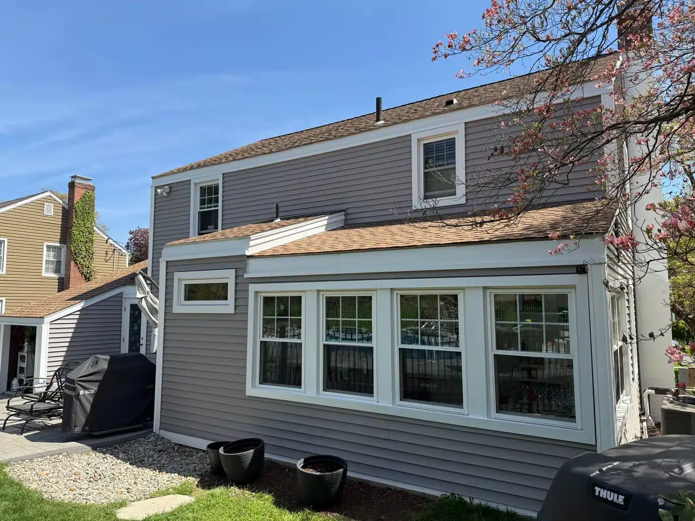Upgraded After Vinyl Siding Vinyl Shake ProVia Entry Door Aluminum Trim Installation West Hartford CT Peter L Brown Completed exterior renovation project in West Hartford CT featuring vinyl siding, vinyl shake, ProVia entry door, and aluminum trim installation by Peter L Brown Roofing Contractors showcasing a finished residential home upgrade