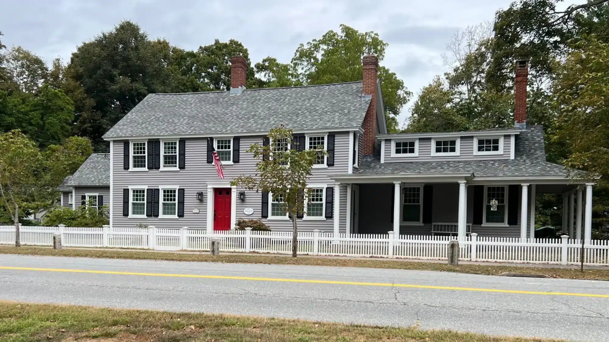how-long-vinyl-siding-installation-really-takes-and-what-to-expect-in-east-granby-ct A worker installing vinyl siding on a house exterior
