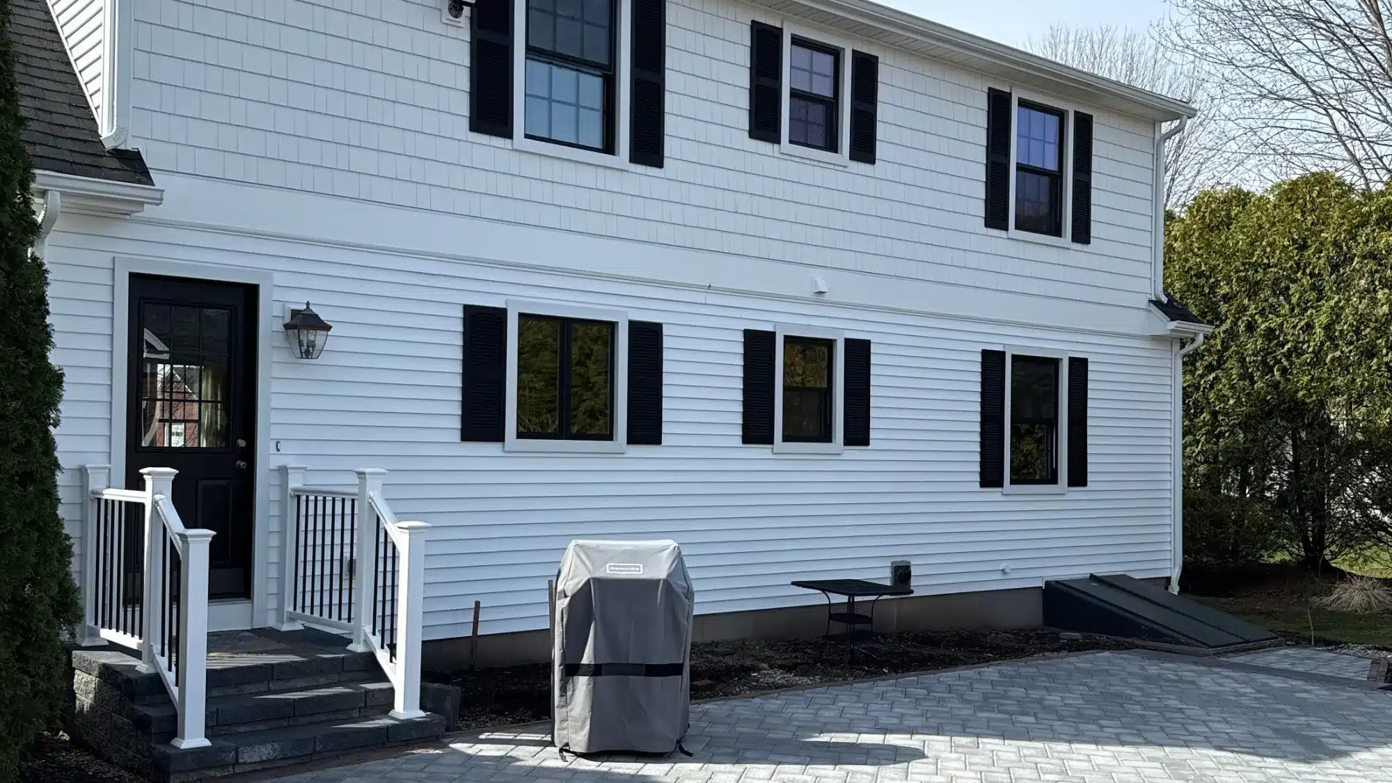 finding-the-best-door-replacement-company-near-you-starts-with-these-essential-expert-tips A beautiful new front door enhancing the curb appeal of a charming home.